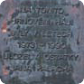 A plaque hangs beside the grave of the Palach family. The inscription is incorrect as the urn with the ashes of Jan Palach was not placed there until 1974. The photo is from 2008 (Photo: Petr Blažek)