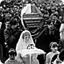 Front of the funeral procession enters the church of Virgin Mary Assumption in Vítkov on Saturday, 2 March, 1969. The coffin with Jan Zajíc´s remains is carried by his schoolmates from the Šumperk technical school. (Photo: Miroslav Hucek) 